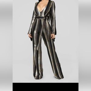 Jumpsuit , black and gold stripes , flare sleeve and flare bottoms